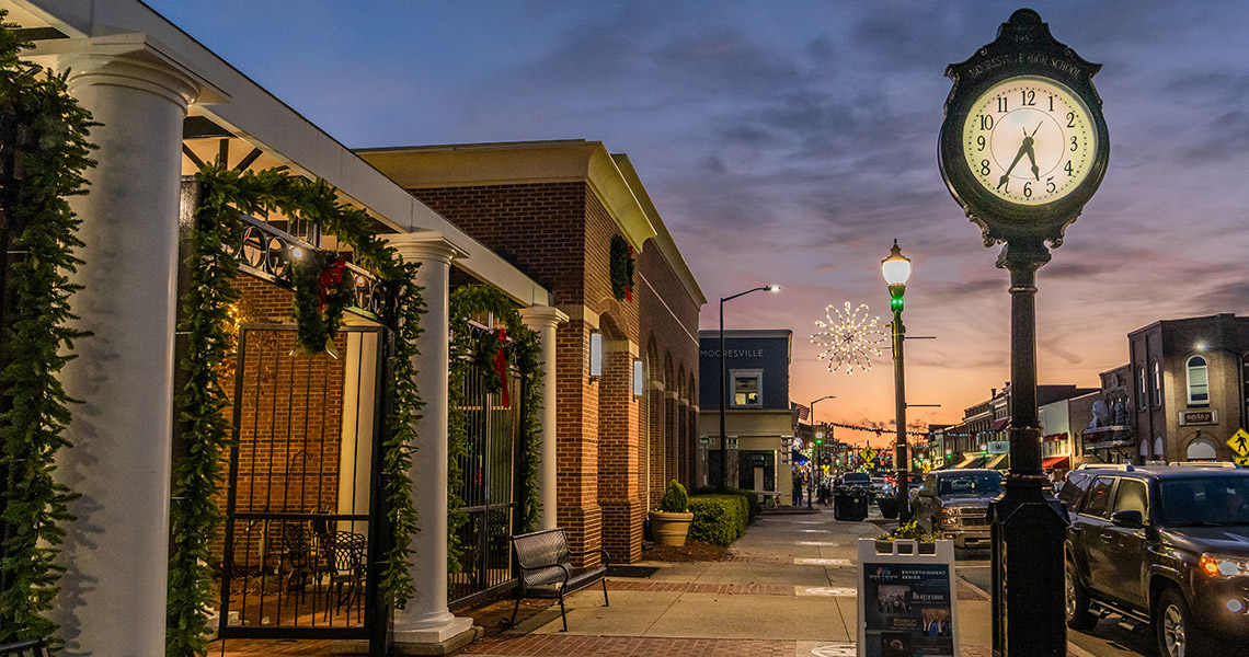 Downtown Mooresville with historic clock tower at dusk
